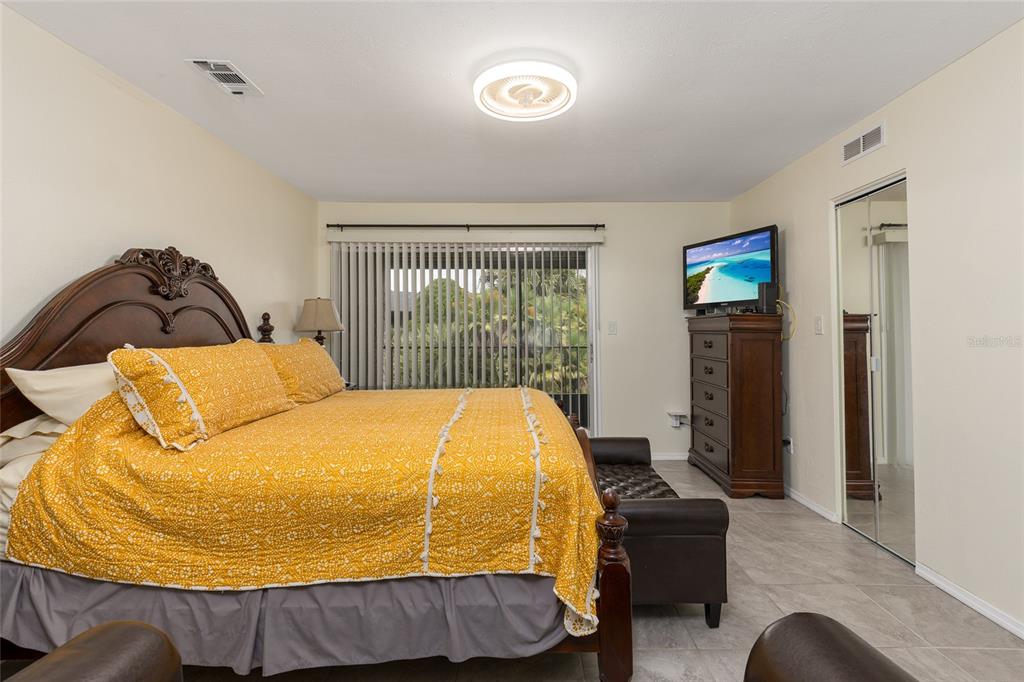 2004 Ludlow Lane, Unit 2803 Orlando, FL 32839 - Photo 17 of 31 a bed sitting in a bedroom next to a window