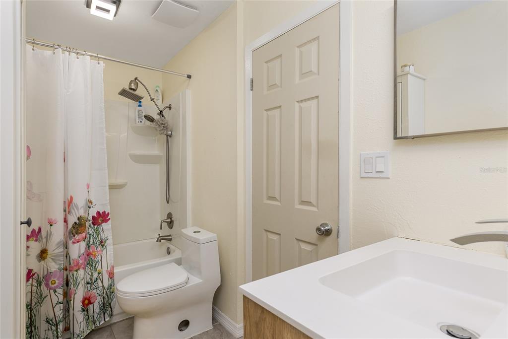 2004 Ludlow Lane, Unit 2803 Orlando, FL 32839 - Photo 19 of 31 a bathroom with a sink toilet and shower