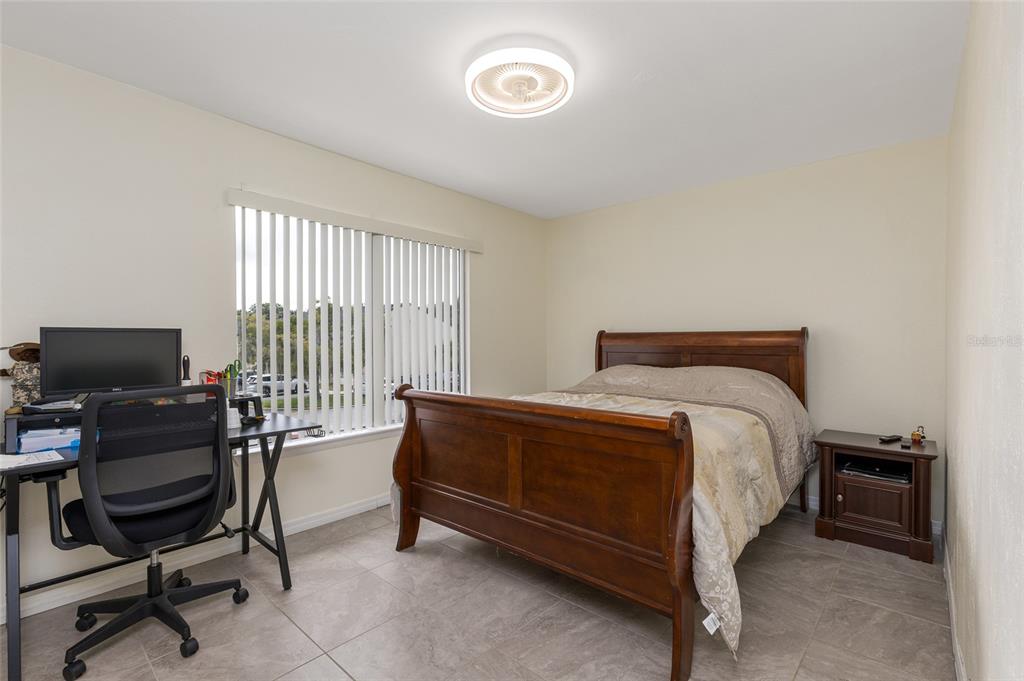 2004 Ludlow Lane, Unit 2803 Orlando, FL 32839 - Photo 20 of 31 a bedroom with a bed and a window