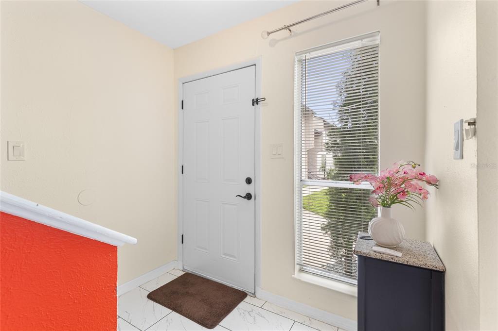 2004 Ludlow Lane, Unit 2803 Orlando, FL 32839 - Photo 2 of 31 a living room with furniture and a window