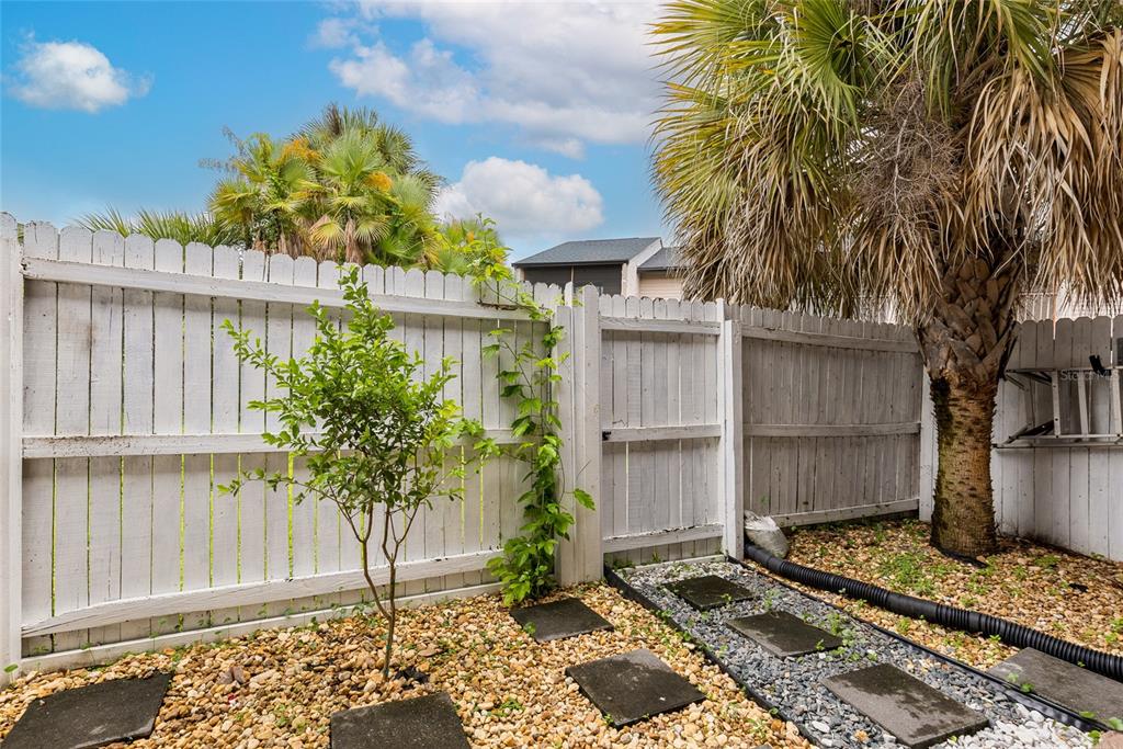 2004 Ludlow Lane, Unit 2803 Orlando, FL 32839 - Photo 22 of 31 a front view of a house with a garden