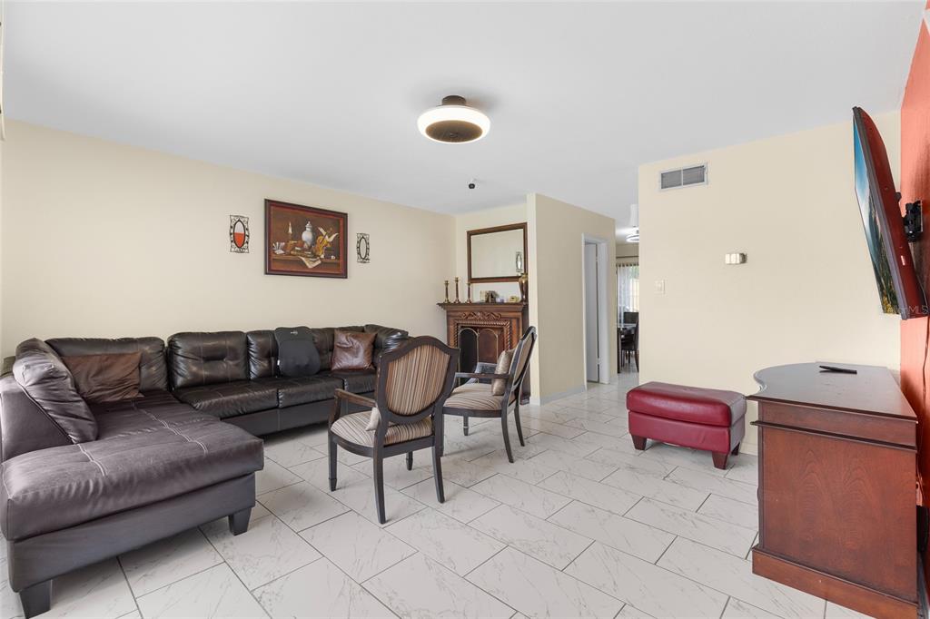 2004 Ludlow Lane, Unit 2803 Orlando, FL 32839 - Photo 3 of 31 a living room with furniture