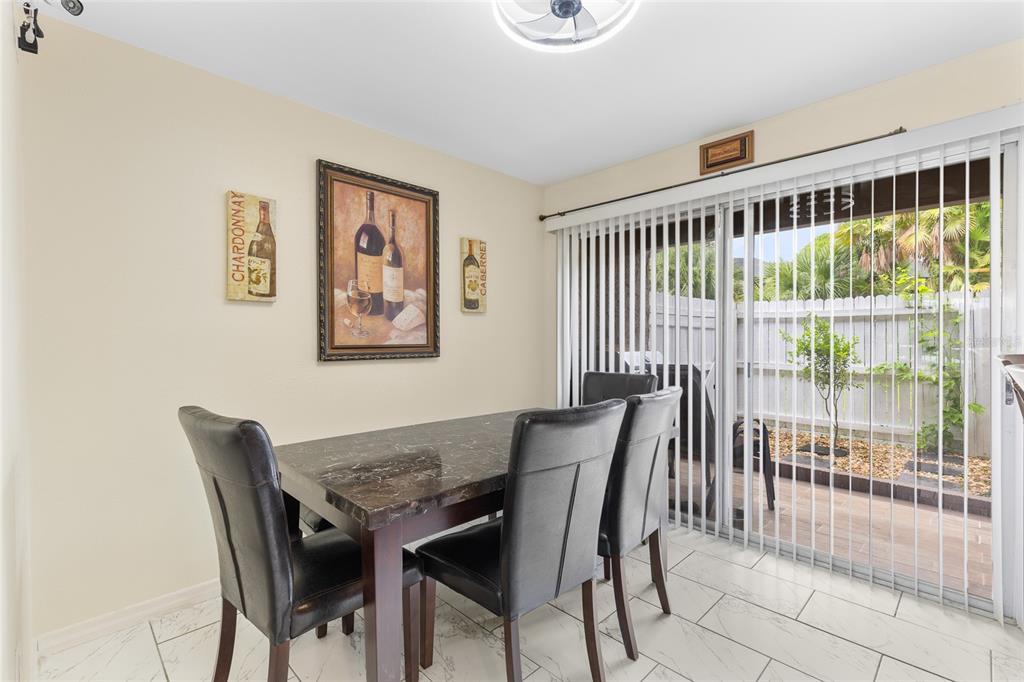 2004 Ludlow Lane, Unit 2803 Orlando, FL 32839 - Photo 8 of 31 a view of a dining room with furniture