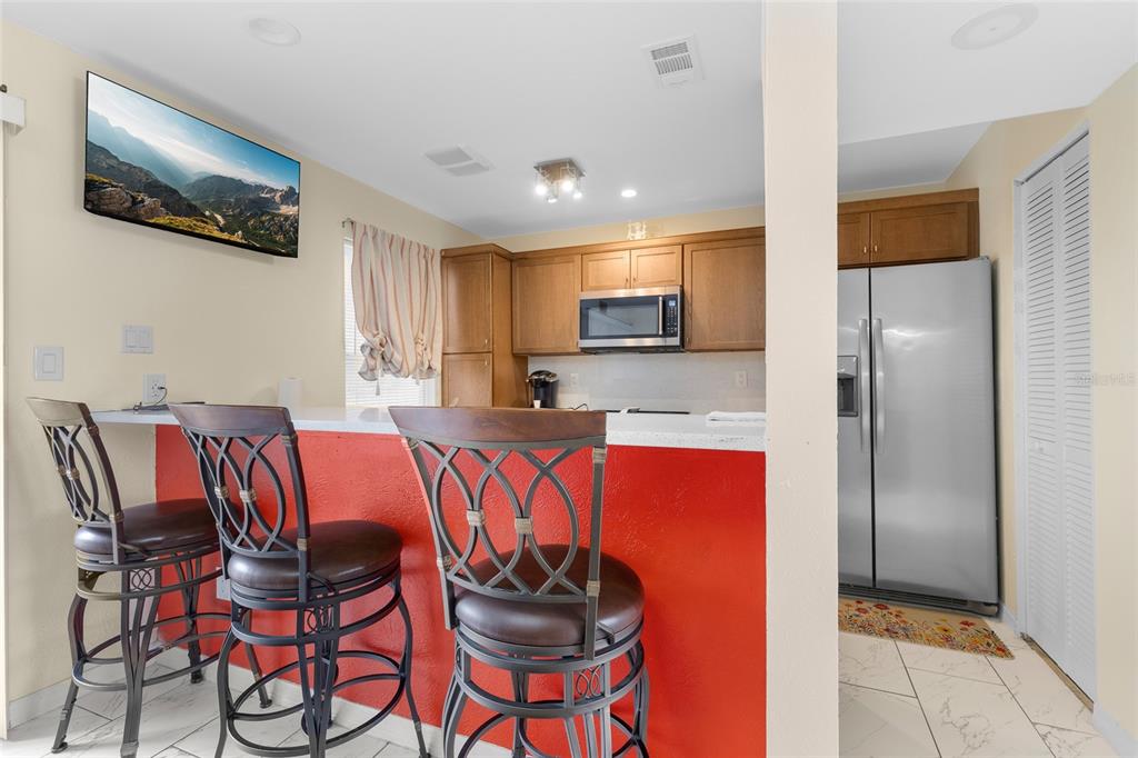 2004 Ludlow Lane, Unit 2803 Orlando, FL 32839 - Photo 9 of 31 a kitchen with stainless steel appliances granite countertop a refrigerator and a stove top oven