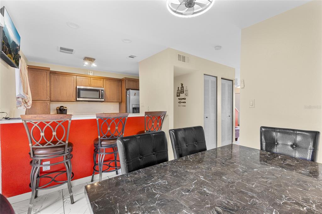 2004 Ludlow Lane, Unit 2803 Orlando, FL 32839 - Photo 10 of 31 a view of kitchen with stainless steel appliances granite countertop cabinets and wooden floor