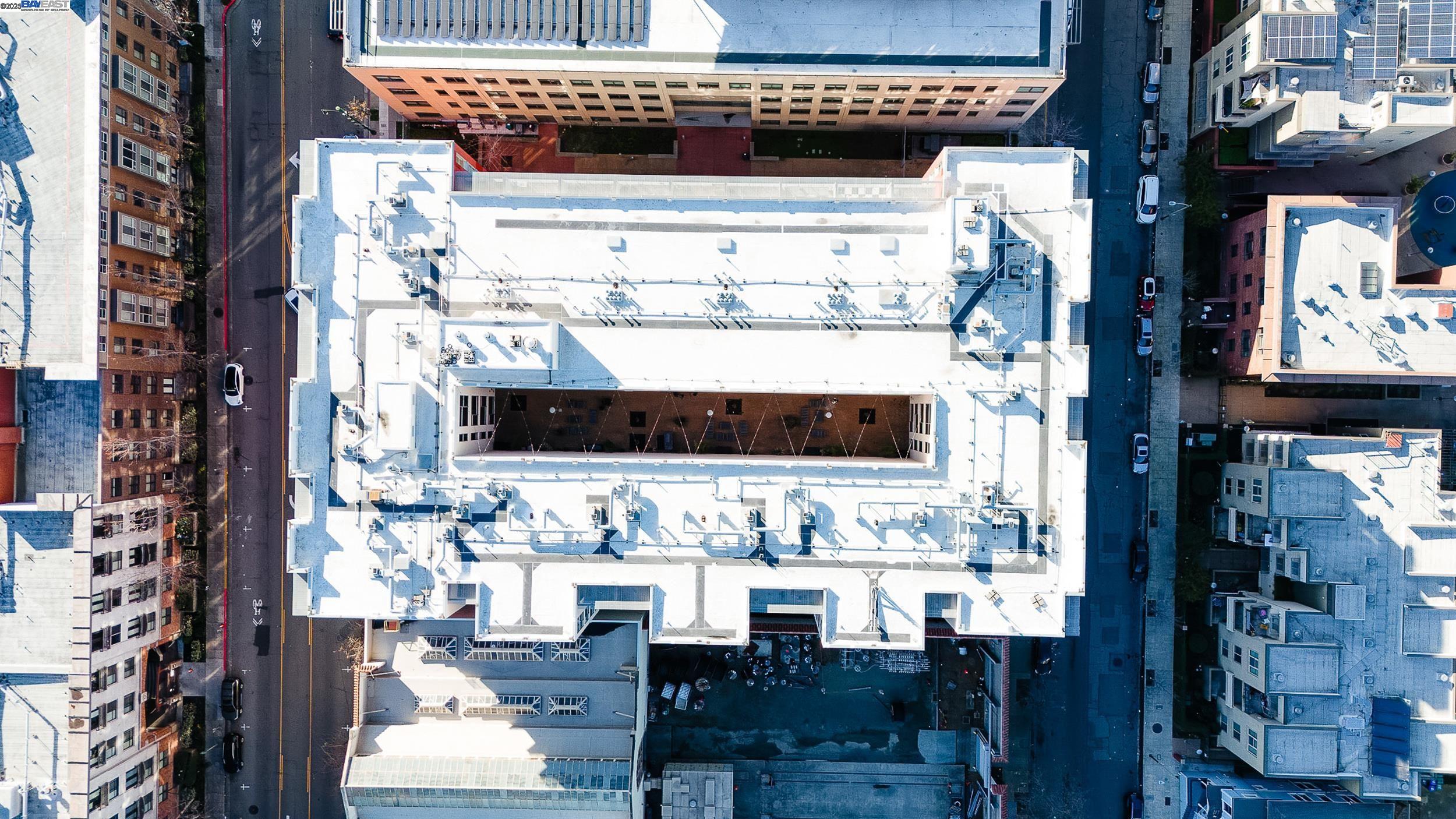 630 Thomas L Berkley Way, Unit 403 Oakland, CA 94612 - Photo 3 of 29 a view of living room kitchen with patio and furniture