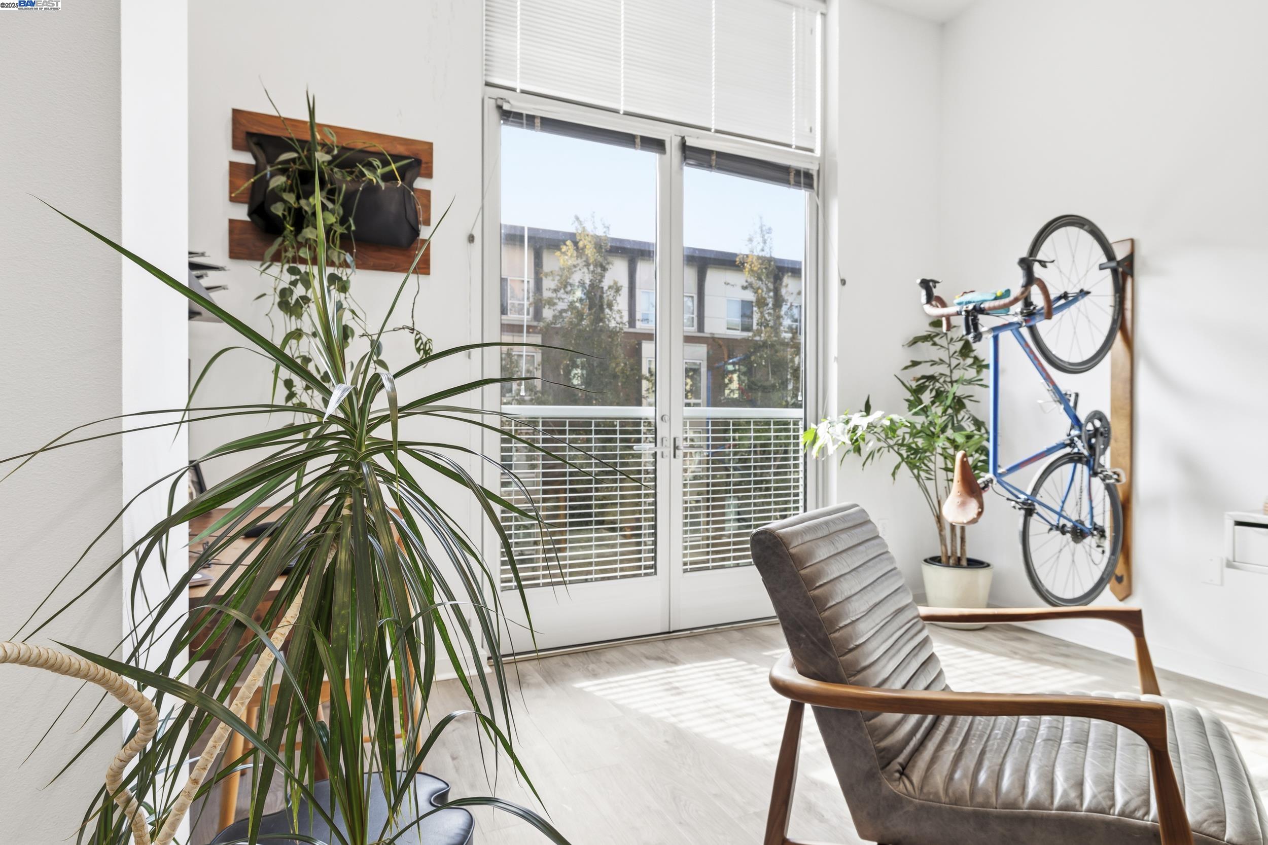 630 Thomas L Berkley Way, Unit 403 Oakland, CA 94612 - Photo 10 of 29 a view of balcony with a potted plant and a window