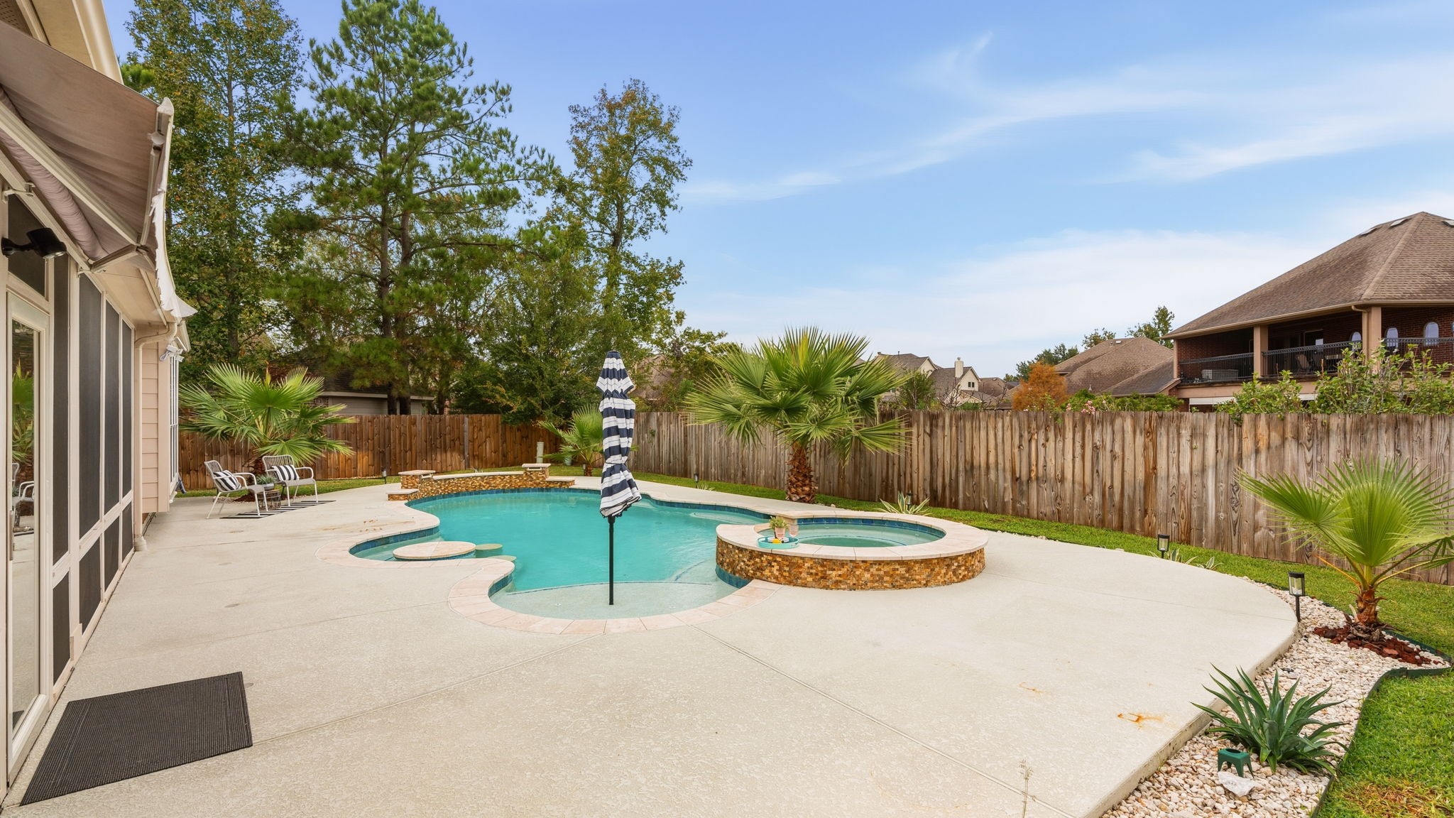 307 Arbor Ridge Lane Conroe, TX 77384 - Photo 39 of 50 a view of a backyard with swimming pool