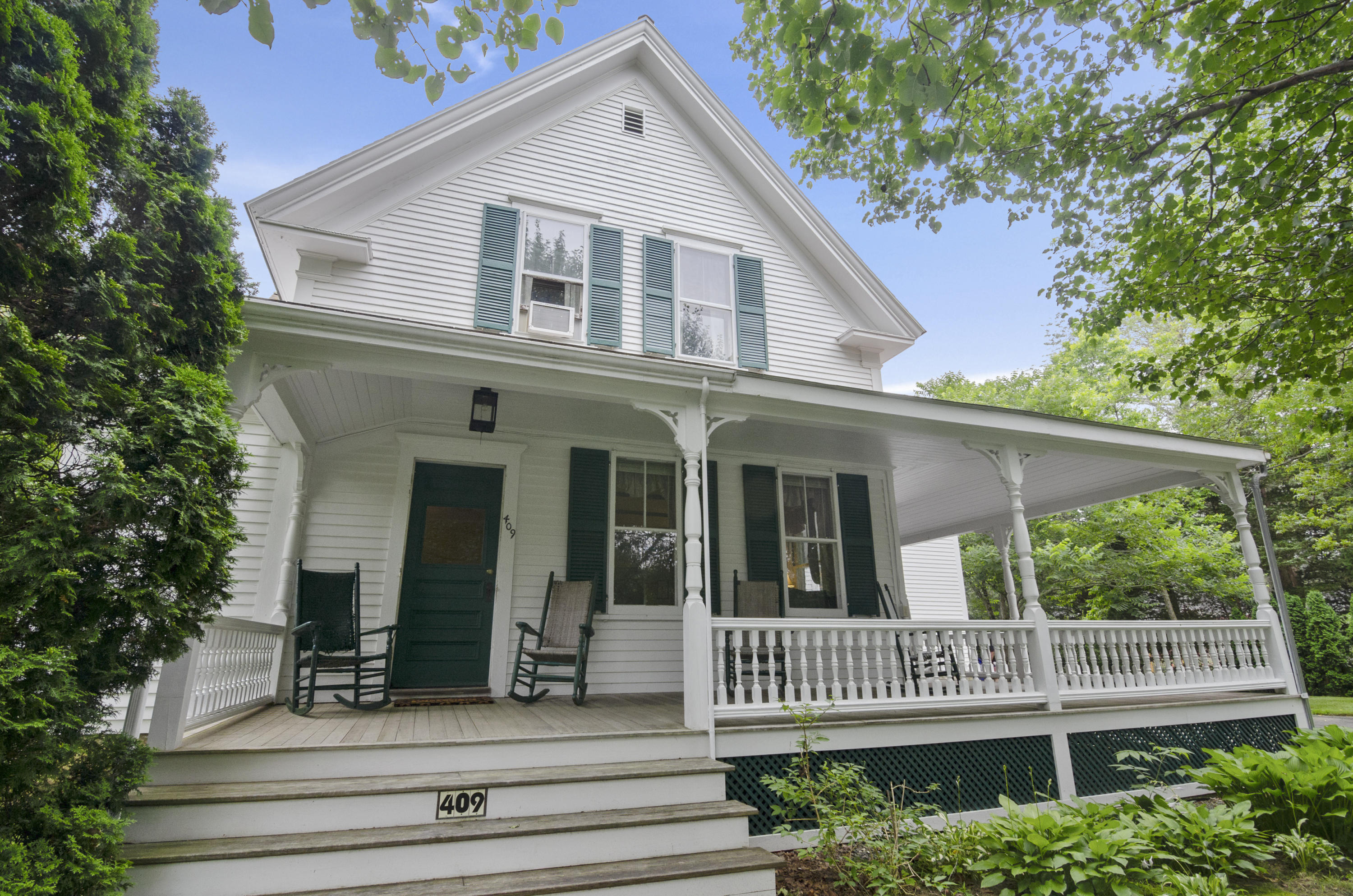 409 Barlows Landing Road Pocasset, MA 02559 - Photo 1 of 26 a front view of a house with garden