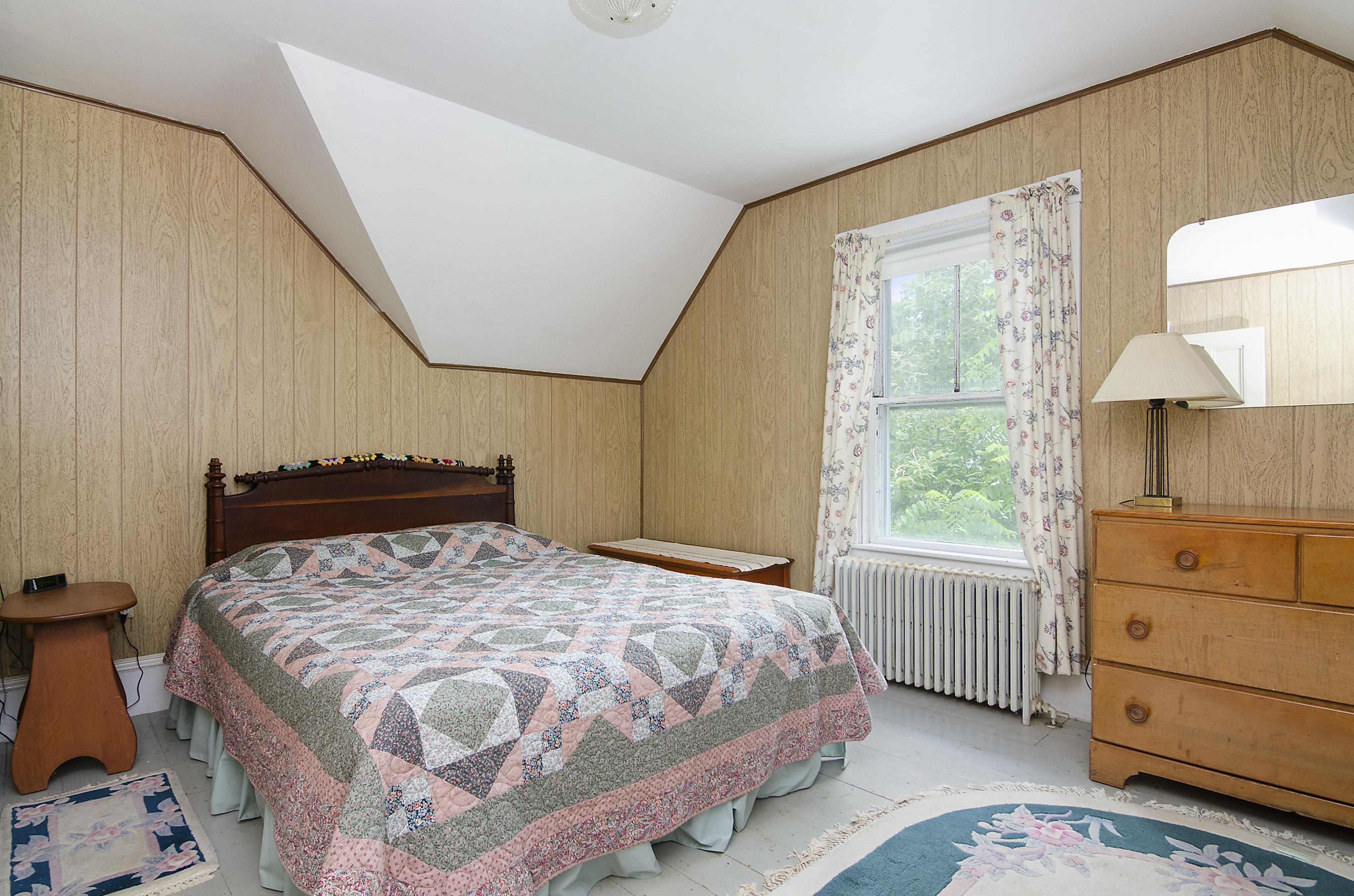 409 Barlows Landing Road Pocasset, MA 02559 - Photo 12 of 26 a bedroom with a bed and a window