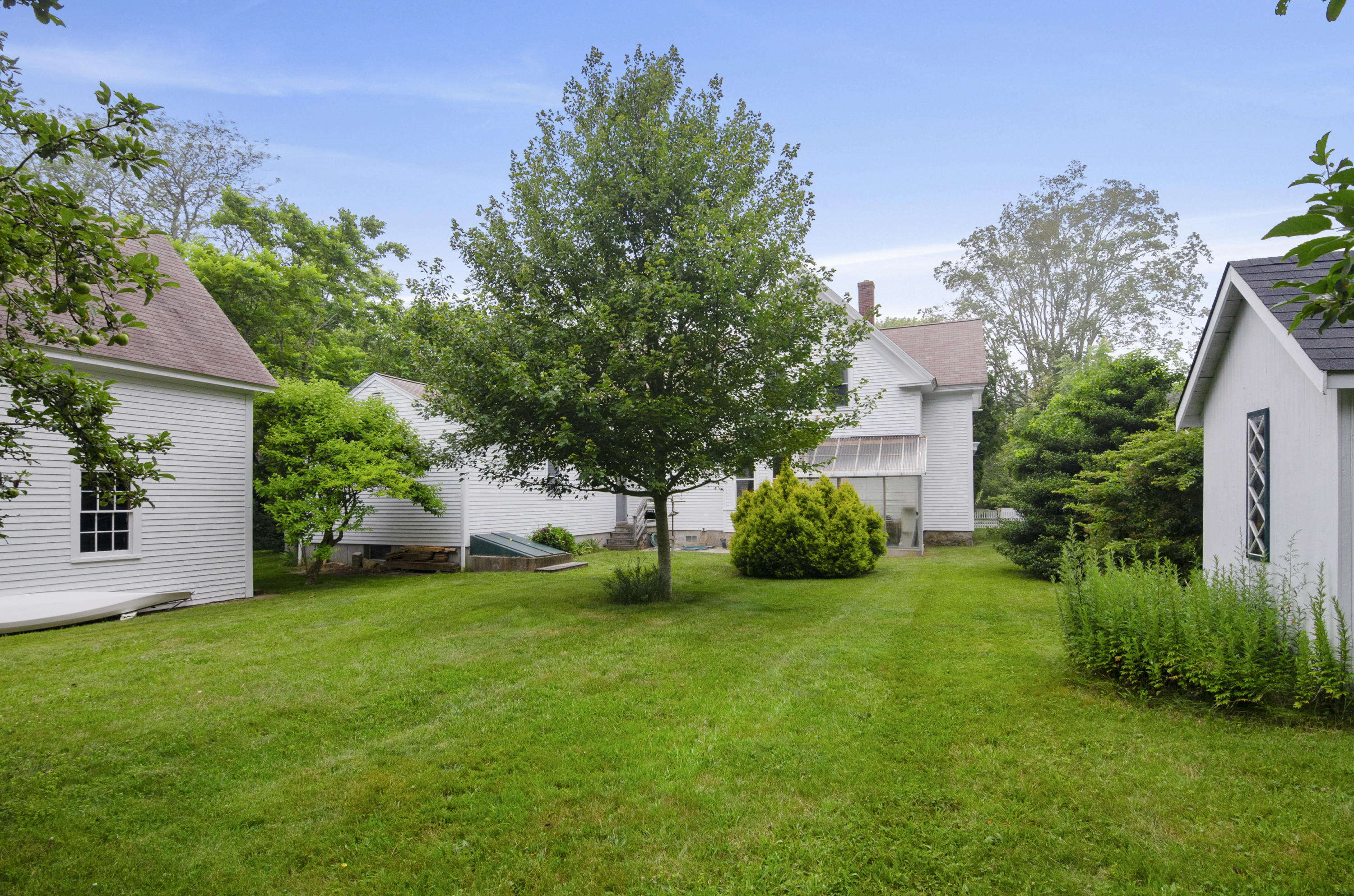 409 Barlows Landing Road Pocasset, MA 02559 - Photo 18 of 26 a view of a house with backyard and garden