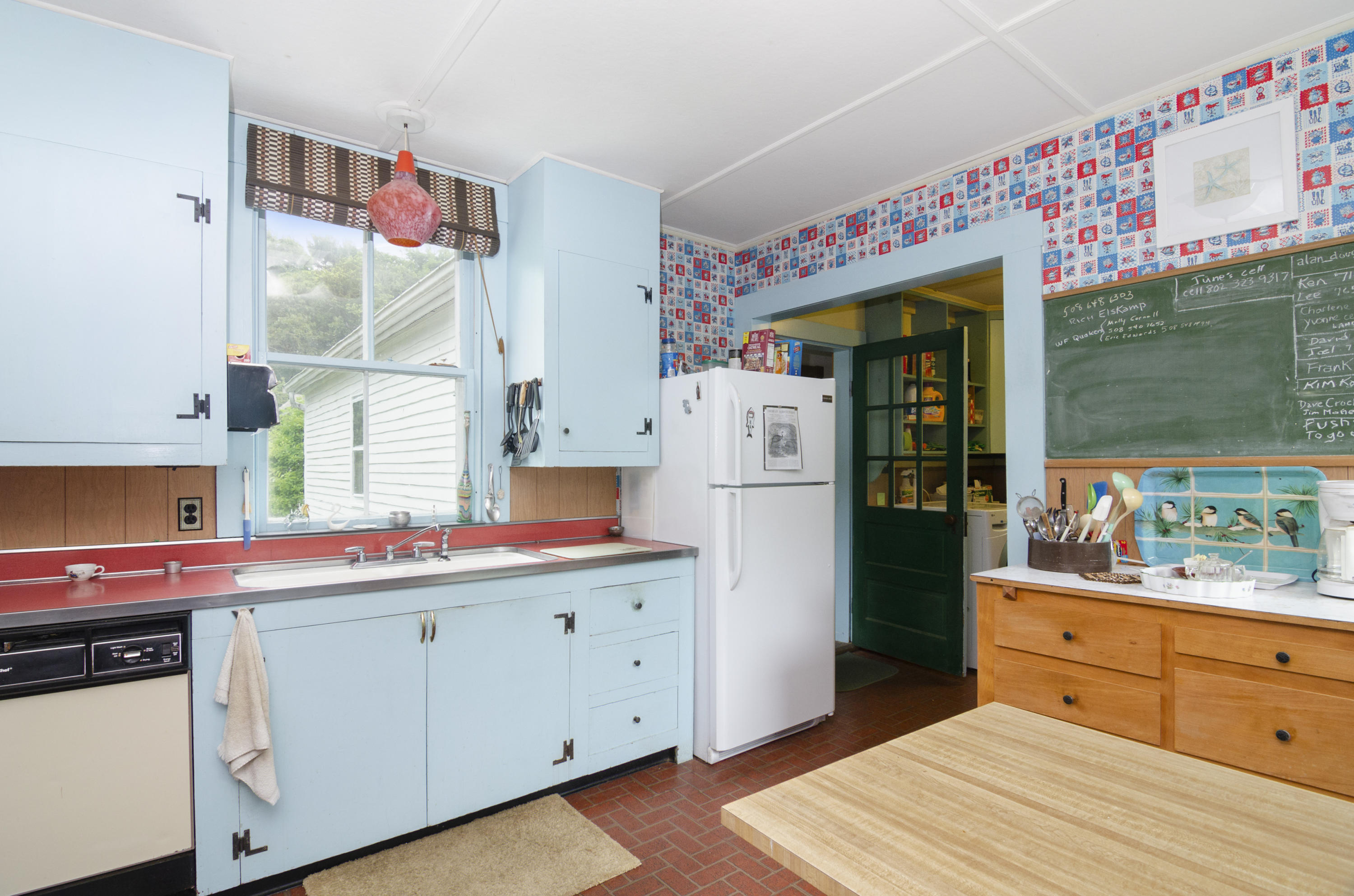 409 Barlows Landing Road Pocasset, MA 02559 - Photo 5 of 26 a kitchen that has a lot of cabinets in it