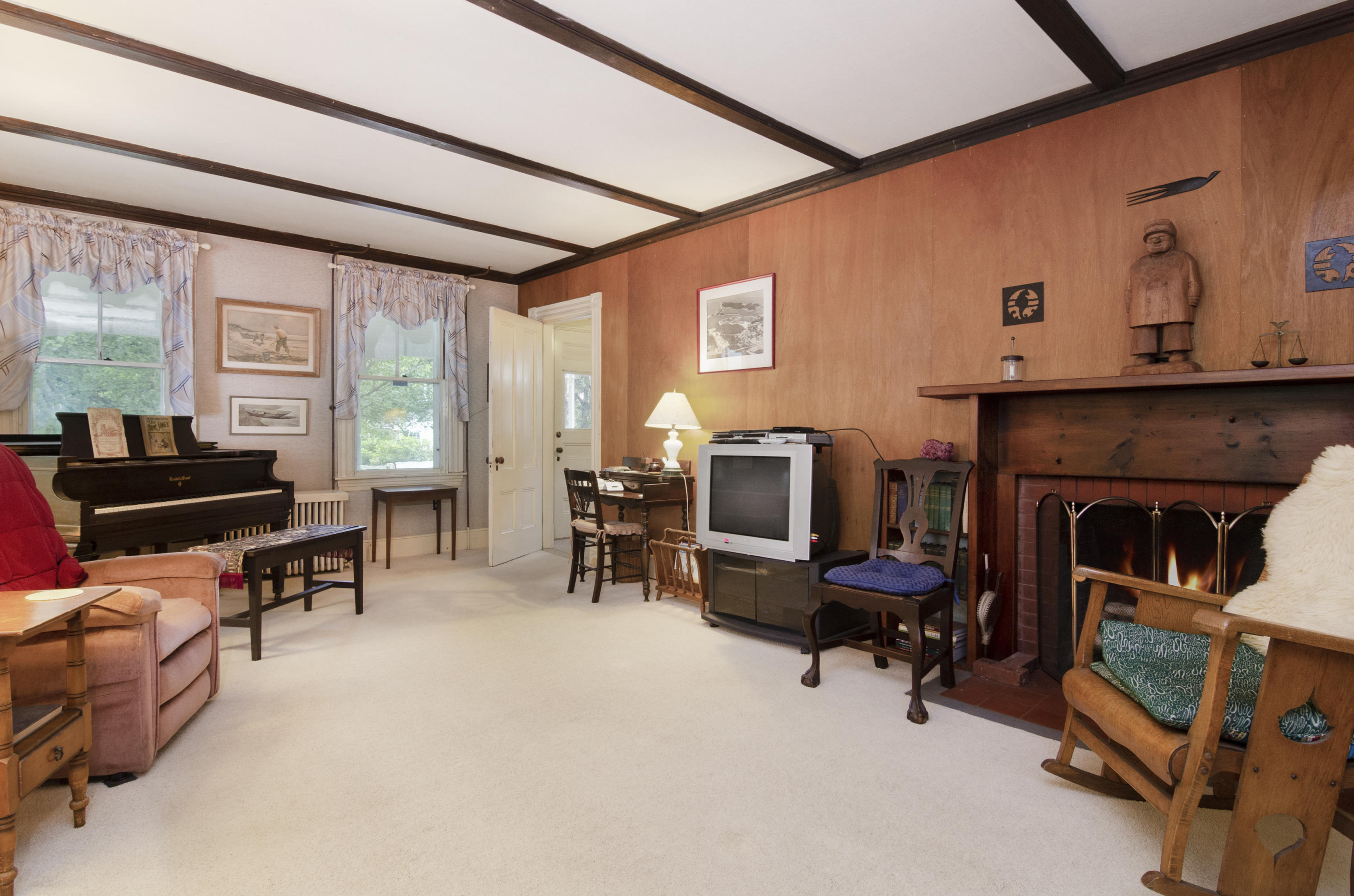 409 Barlows Landing Road Pocasset, MA 02559 - Photo 7 of 26 a living room with furniture and a fireplace