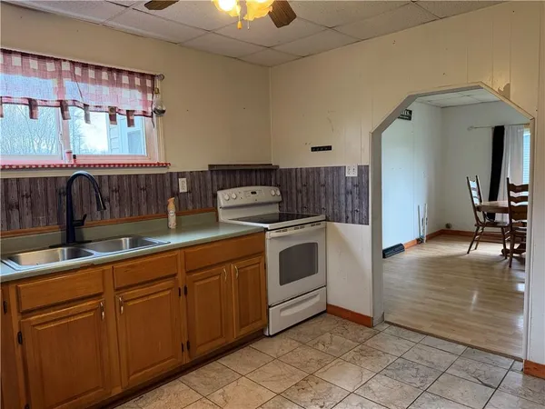 a view of a dining room with furniture and window