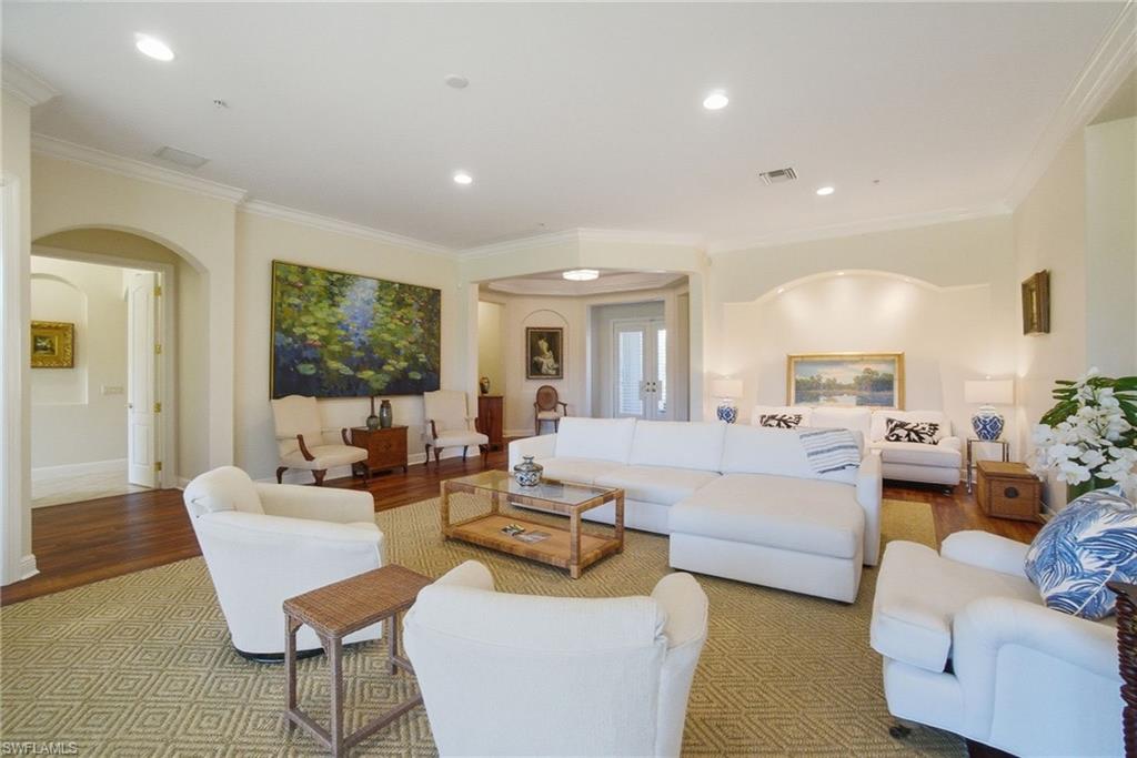 17015 Porta Vecchio Way, Unit 101 Naples, FL 34110 - Photo 6 of 39 a living room with furniture and a large window