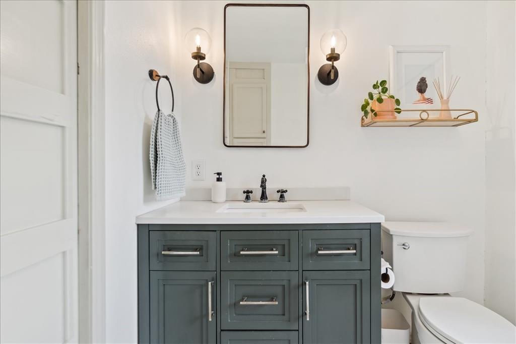13347 Old China Spring Road China Spring, TX 76633 - Photo 20 of 38 a bathroom with a granite countertop sink mirror and toilet