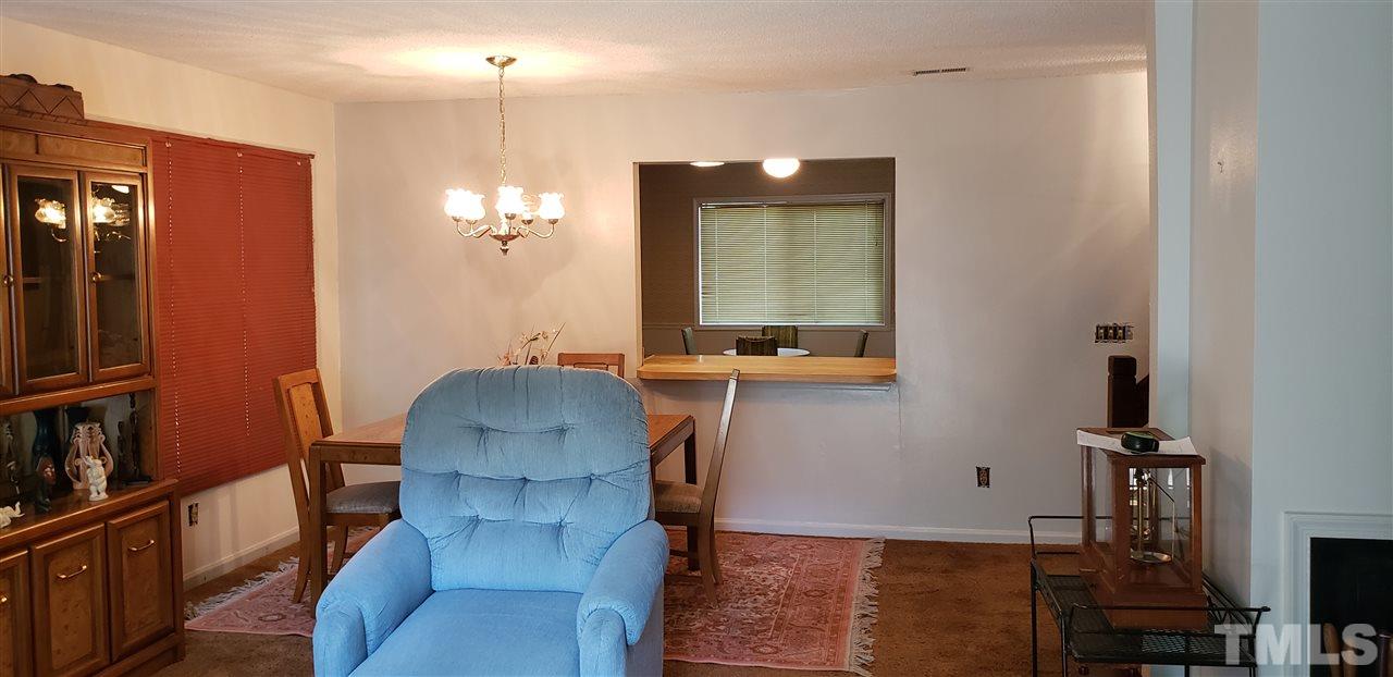 1227 Seaton Road, Unit 55 Durham, NC 27713 - Photo 4 of 6 a view of a hallway with workspace