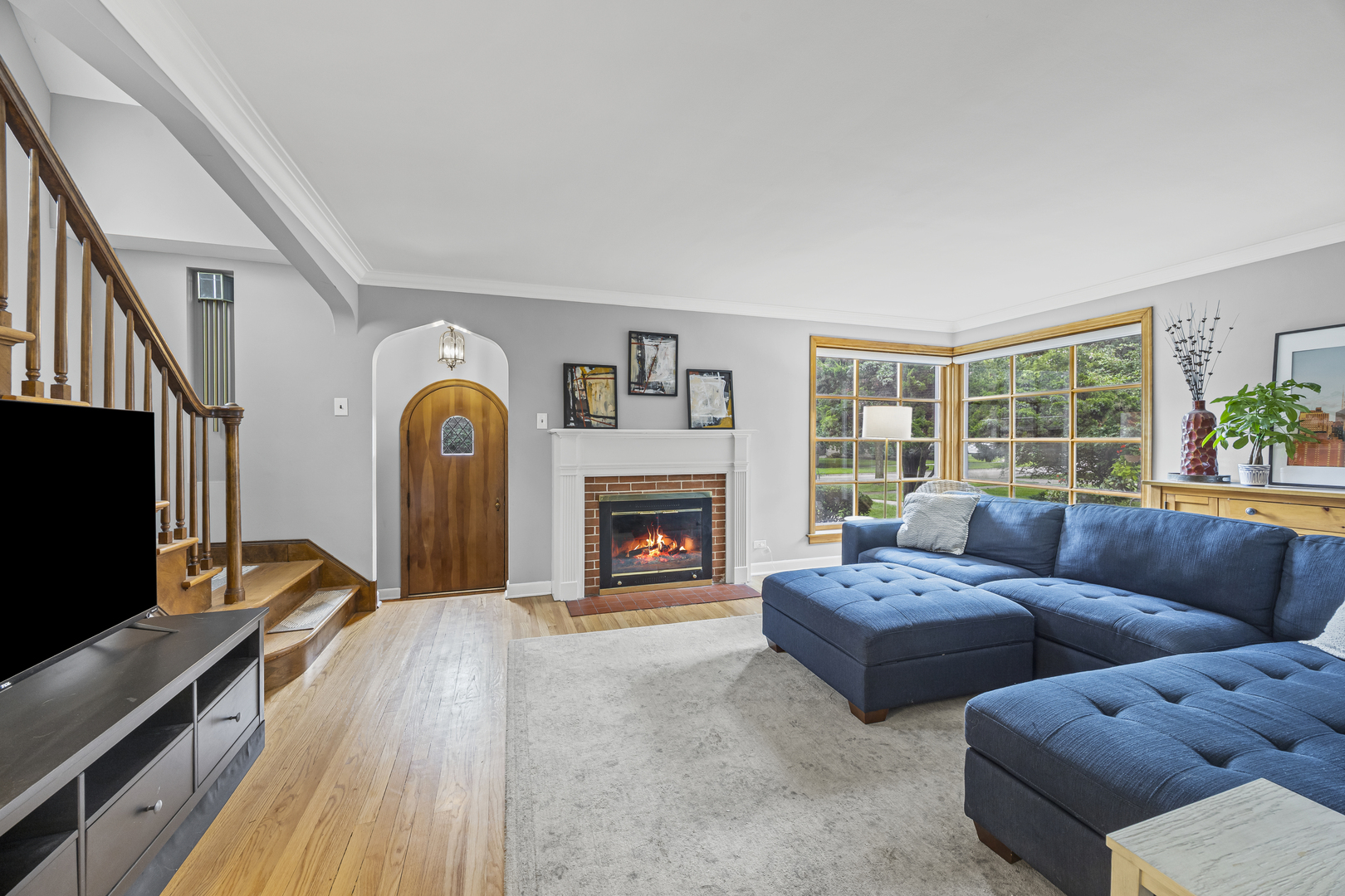 530 Byrd Road Riverside, IL 60546 - Photo 3 of 23 a living room with fireplace furniture and a flat screen tv