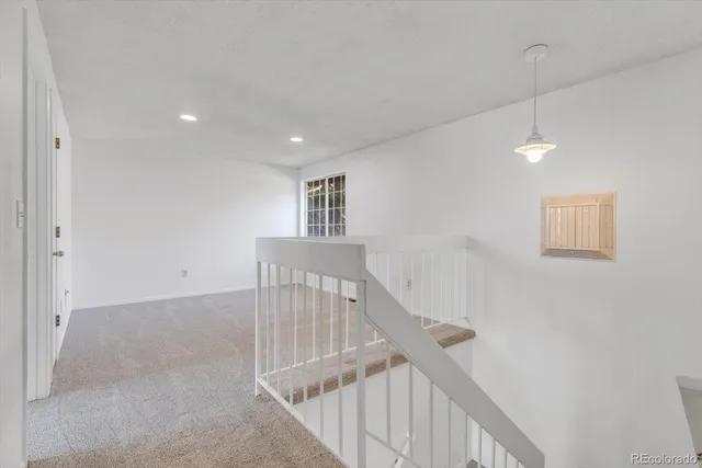 a view of a hallway with stairs