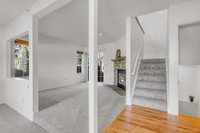 a view of entryway with furniture and wooden floor