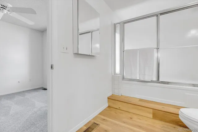 a view of a room with white walls