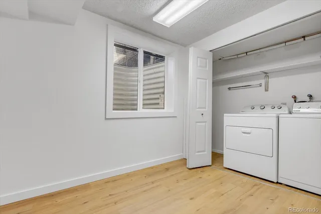 a view of a storage & utility room with closet window