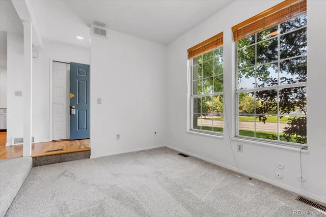 a view of room with window and air conditioner