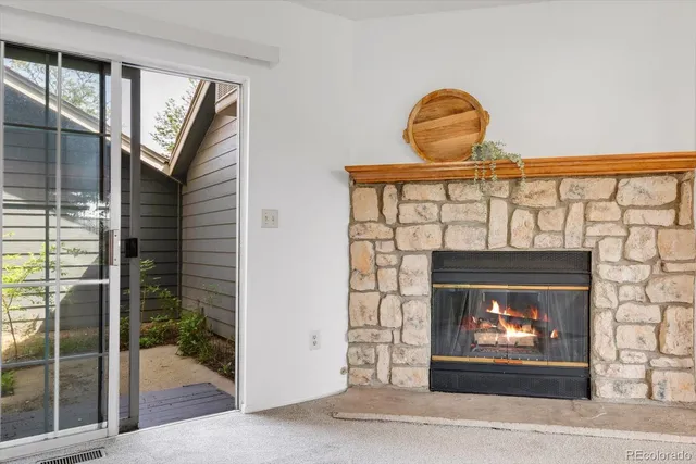 a fireplace with a clock on the wall