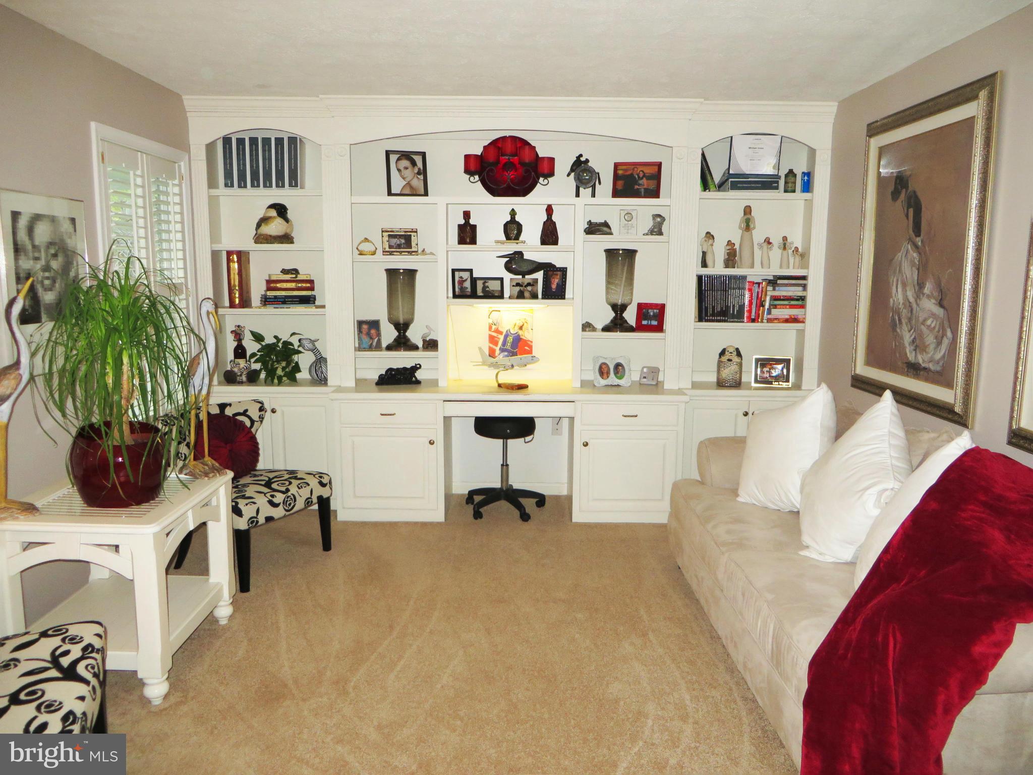 275 Hilltop Road Lusby, MD 20657 - Photo 3 of 30 Living room with built-in bookshelves
