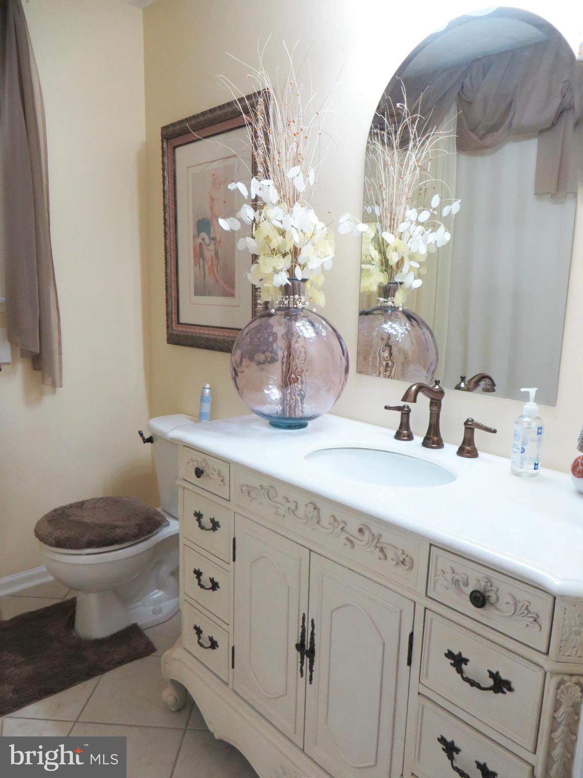 275 Hilltop Road Lusby, MD 20657 - Photo 21 of 30 Upstairs bath w/new vanity and tub/shower