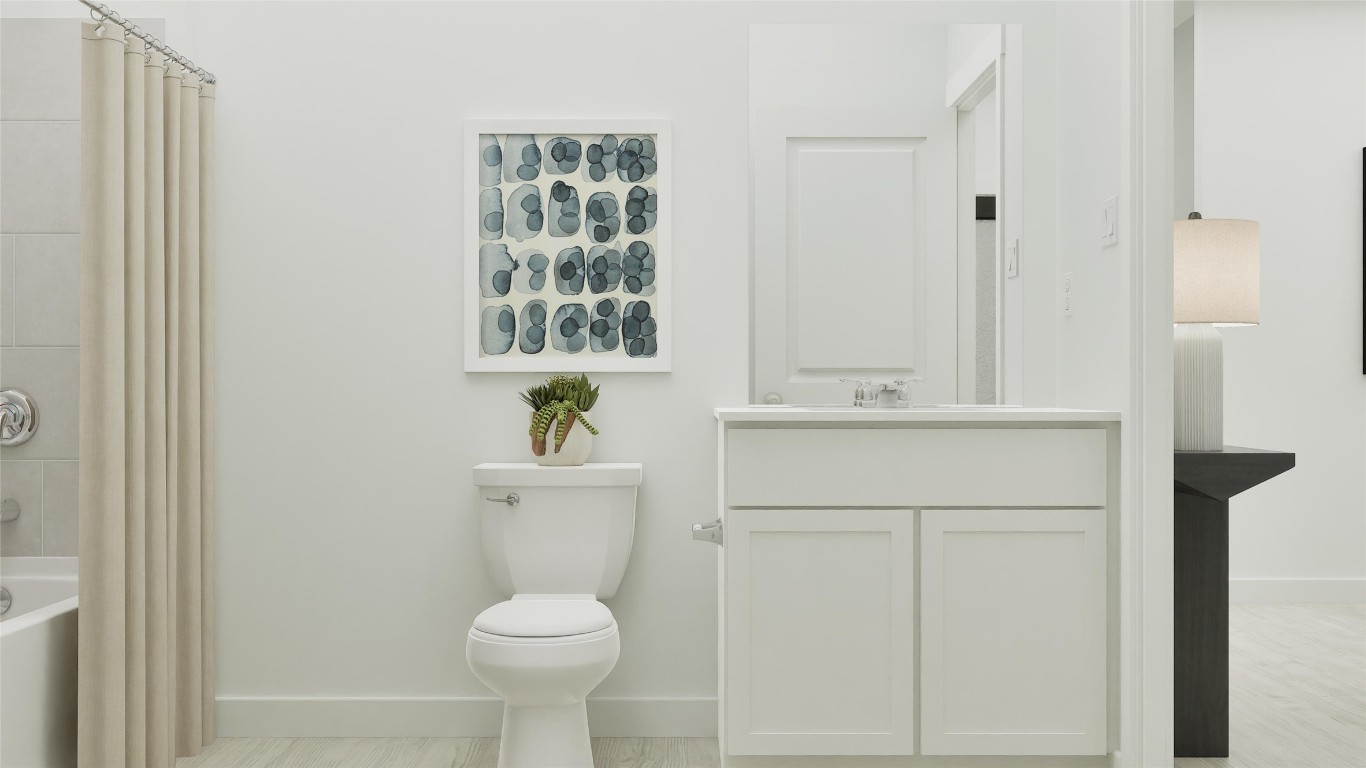 13316 Winton Drive Elgin, TX 78621 - Photo 30 of 35 a bathroom with a sink a toilet and a mirror