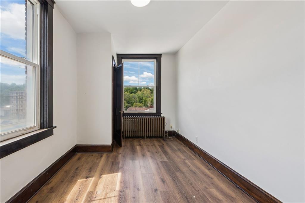 206 North Warren Avenue Apollo, PA 15613 - Photo 10 of 23 a view of empty room with wooden floor and fan