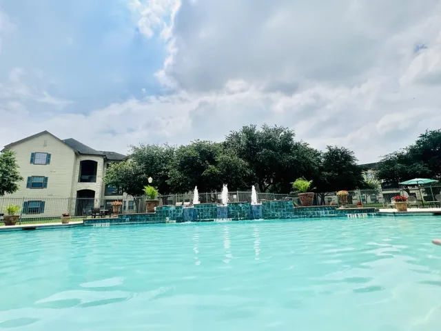 a view of a house with a big yard and sitting area