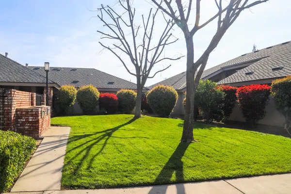 a front view of a house with a yard