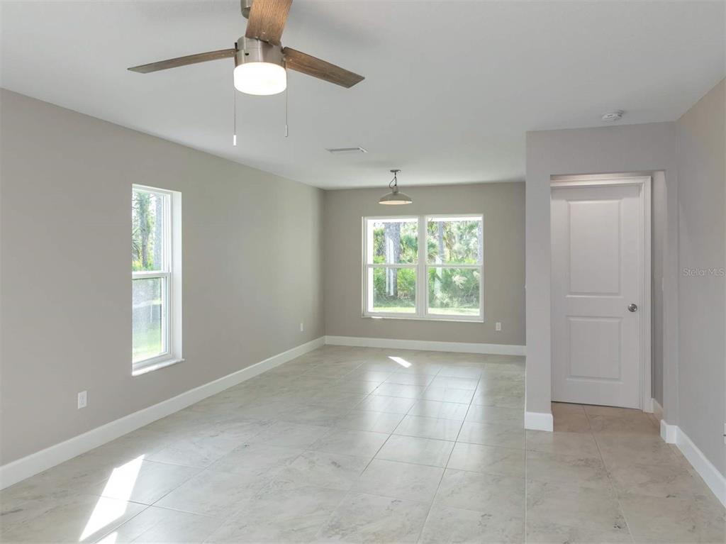 125 Boundary Boulevard, Unit 2 Rotonda West, FL 33947 - Photo 14 of 32 a view of an empty room with a window