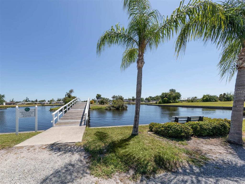 125 Boundary Boulevard, Unit 2 Rotonda West, FL 33947 - Photo 15 of 32 a view of a lake with outdoor space
