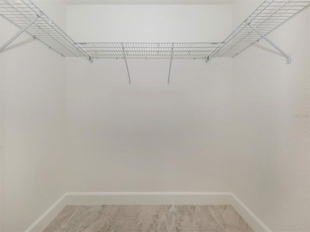 125 Boundary Boulevard, Unit 2 Rotonda West, FL 33947 - Photo 19 of 32 a view of a room with racks on the wall