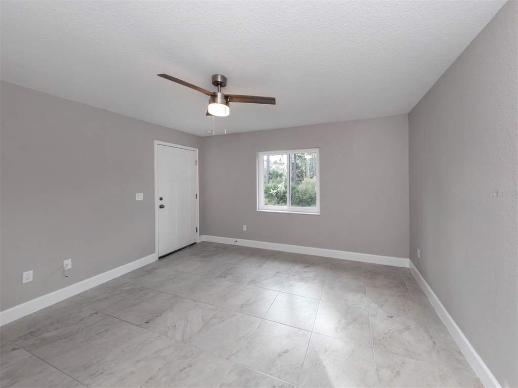 125 Boundary Boulevard, Unit 2 Rotonda West, FL 33947 - Photo 22 of 32 a view of an empty room with a window
