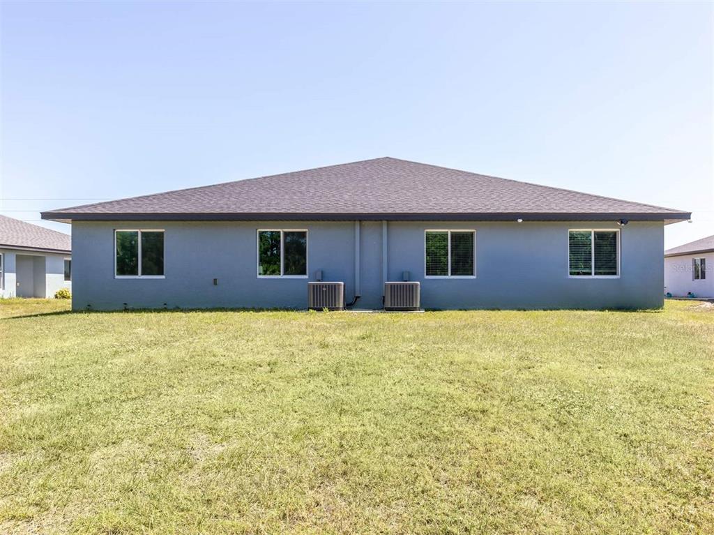 125 Boundary Boulevard, Unit 2 Rotonda West, FL 33947 - Photo 26 of 32 a house view with a outdoor space