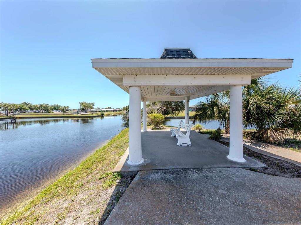 125 Boundary Boulevard, Unit 2 Rotonda West, FL 33947 - Photo 30 of 32 a view of a swimming pool and outdoor space