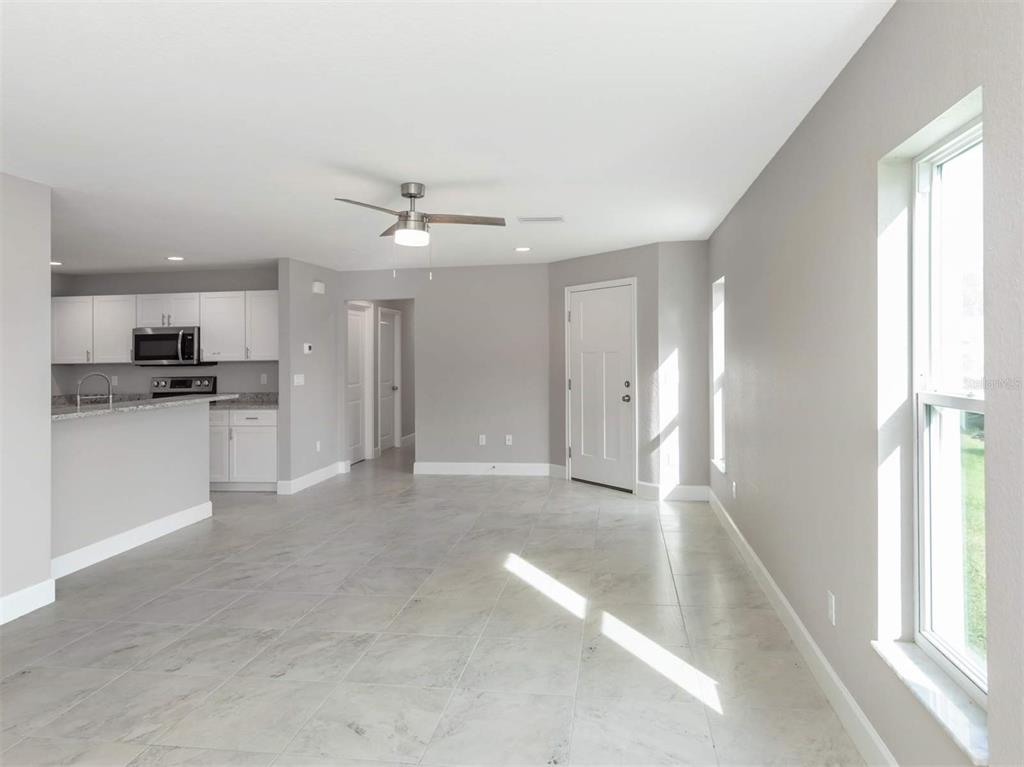 125 Boundary Boulevard, Unit 2 Rotonda West, FL 33947 - Photo 10 of 32 a view of a kitchen with a sink and a window