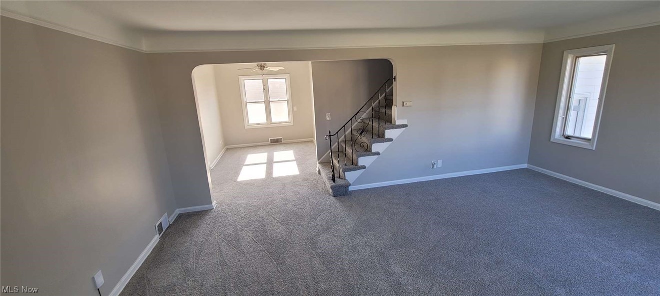 6149 North Canterbury Road Parma, OH 44129 - Photo 2 of 16 Carpeted empty room featuring ornamental molding and ceiling fan