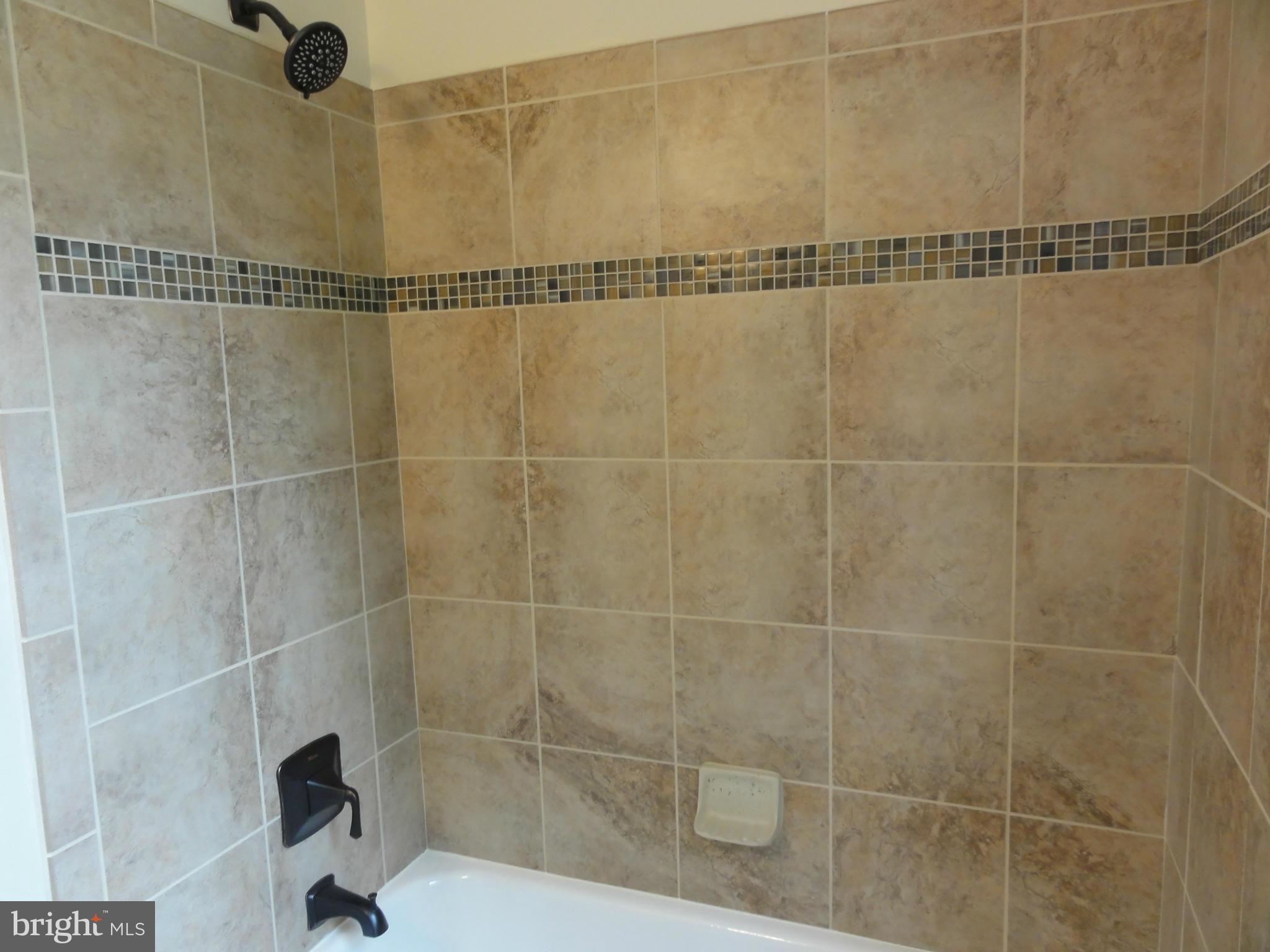 1105 Newfield Road Baltimore, MD 21207 - Photo 18 of 27 Upper level bath with decorative tile