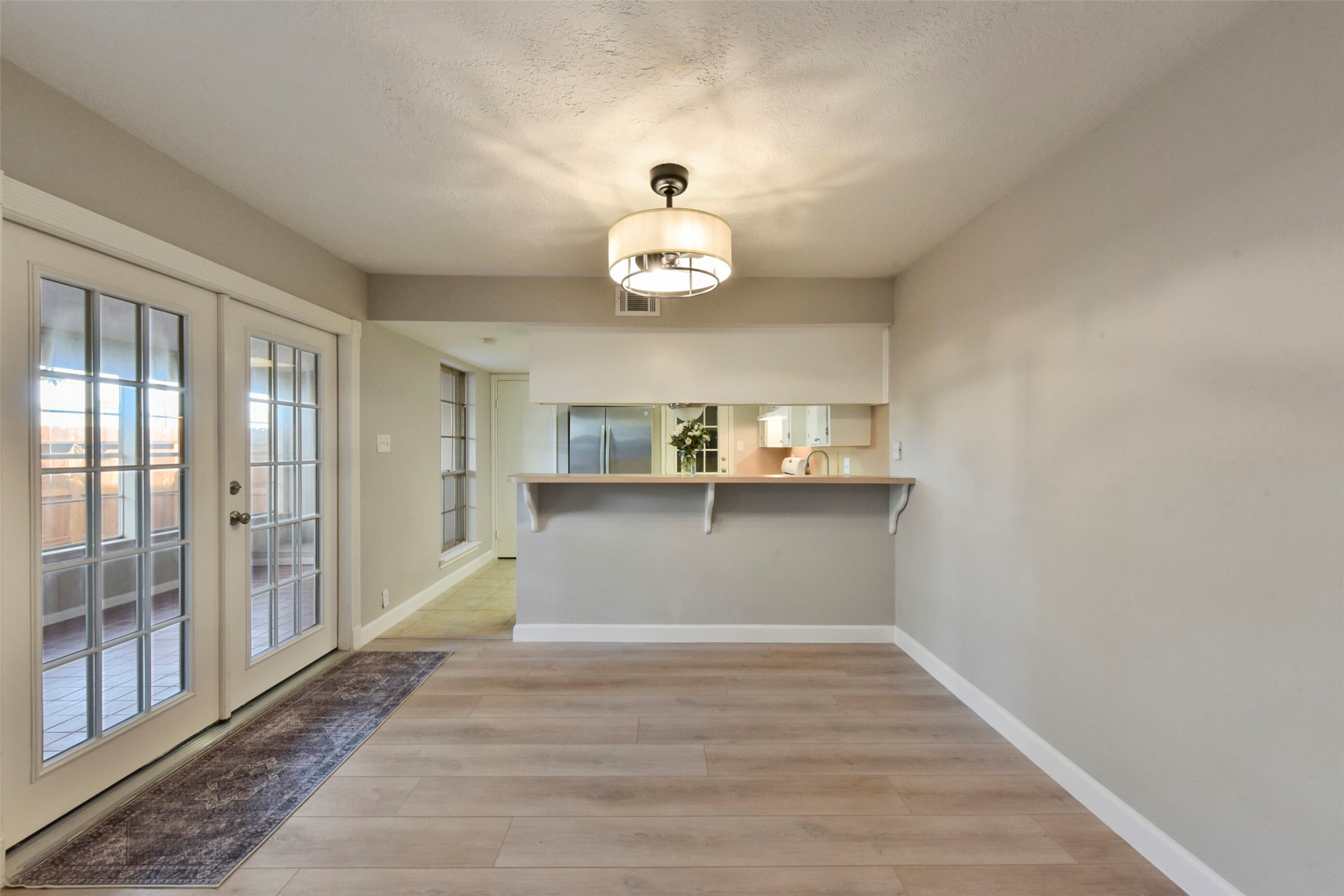 1941 Country Village Boulevard, Unit A Humble, TX 77338 - Photo 11 of 35 a view of kitchen with wooden floor and window