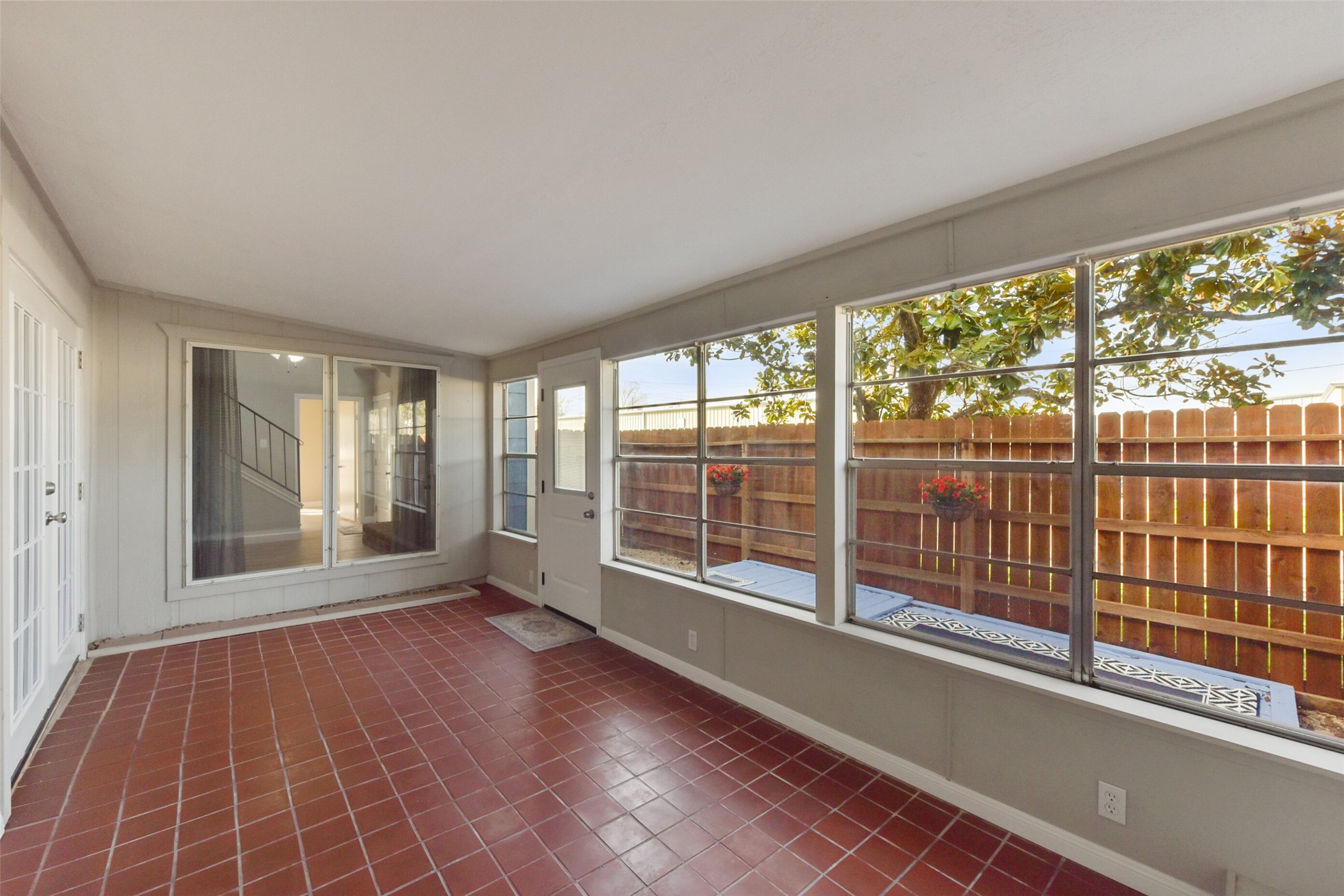 1941 Country Village Boulevard, Unit A Humble, TX 77338 - Photo 3 of 35 an empty room with wooden floor and windows