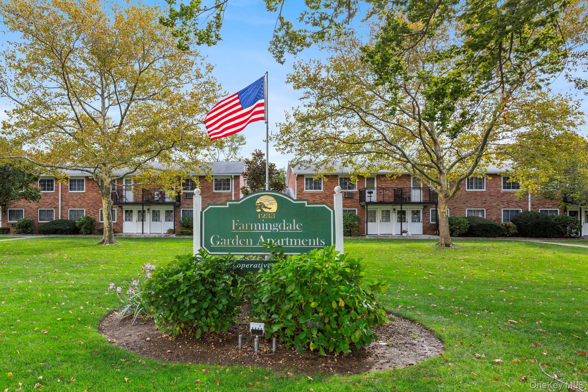 1233 Melville Road, Unit 54 Farmingdale, NY 11735 - Photo 1 of 1 a front view of a house with garden