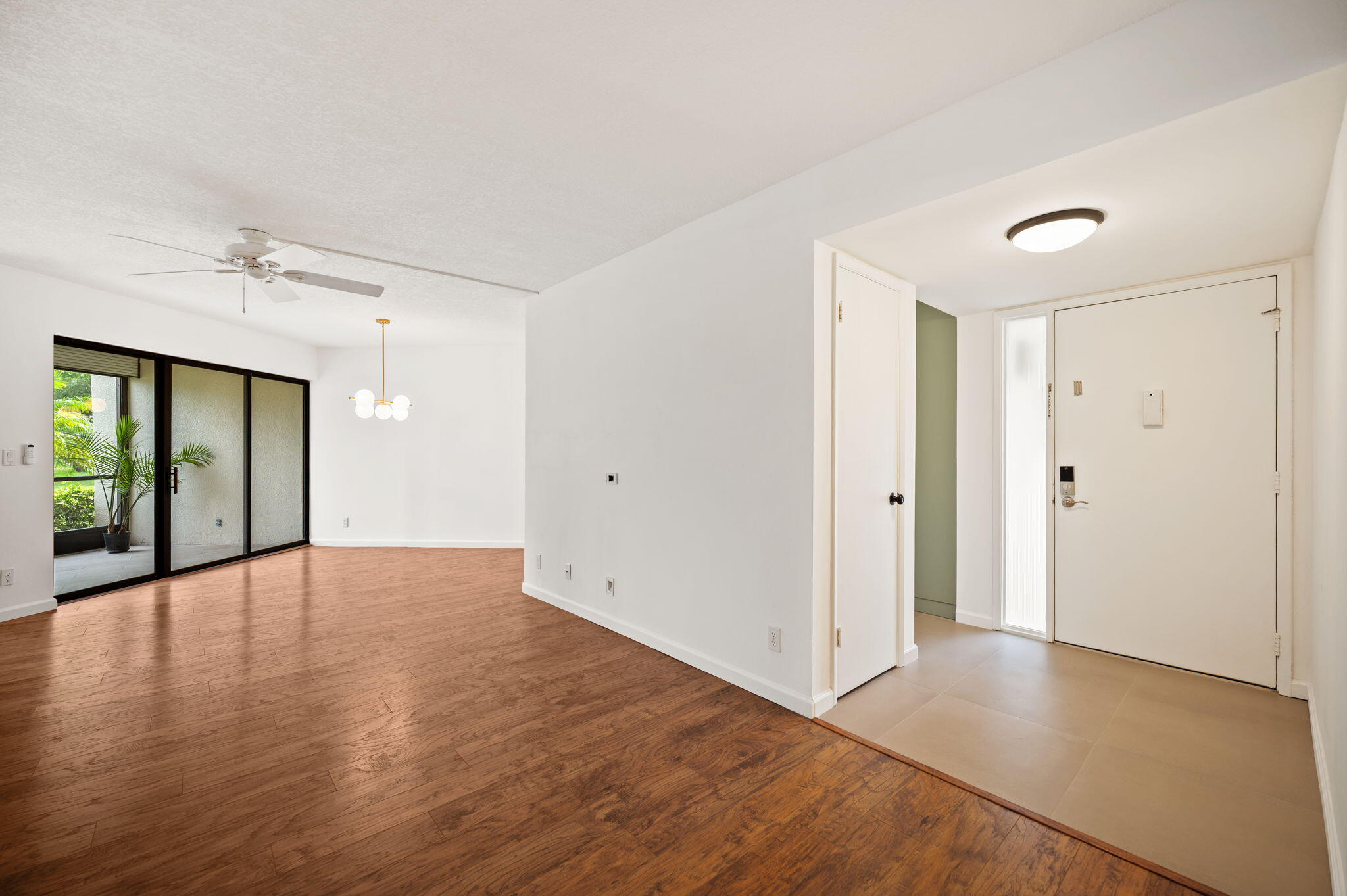 5701 Camino Del Sol, Unit 104 Boca Raton, FL 33433 - Photo 3 of 34 living and dinning room