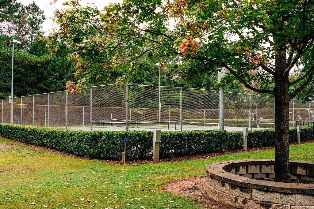 369 Scarlet Rose Way Hoschton, GA 30548 - Photo 102 of 150 a view of a backyard with a garden