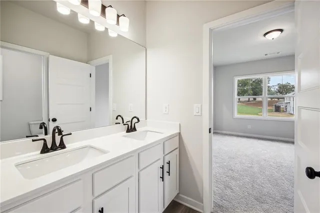 a view of a cafe with a couple of people in front of retail shop