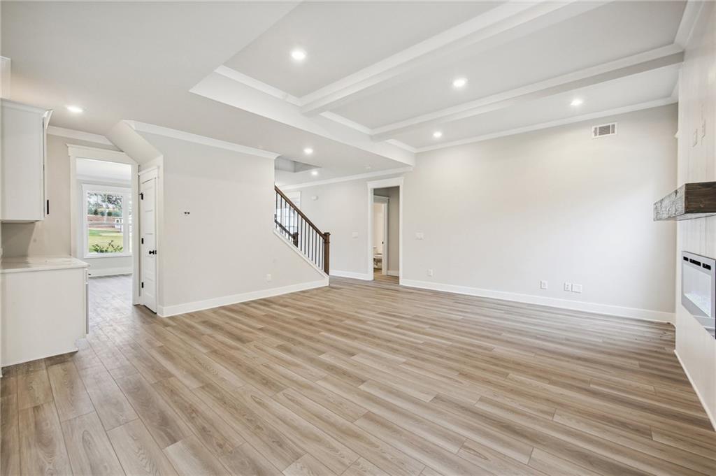 369 Scarlet Rose Way Hoschton, GA 30548 - Photo 6 of 150 a view of empty room with wooden floor